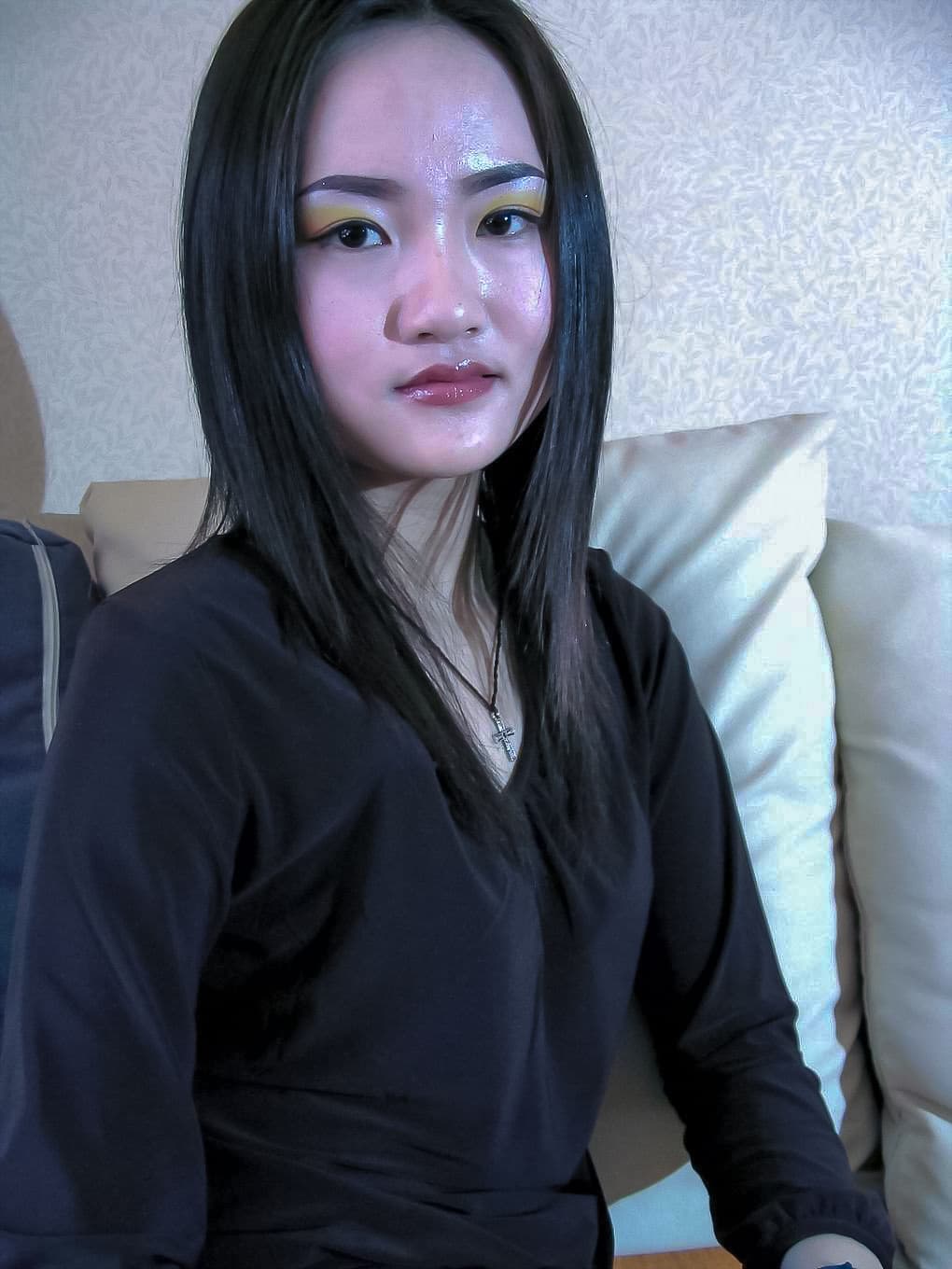 Jingyao’s feet tucked in cotton socks